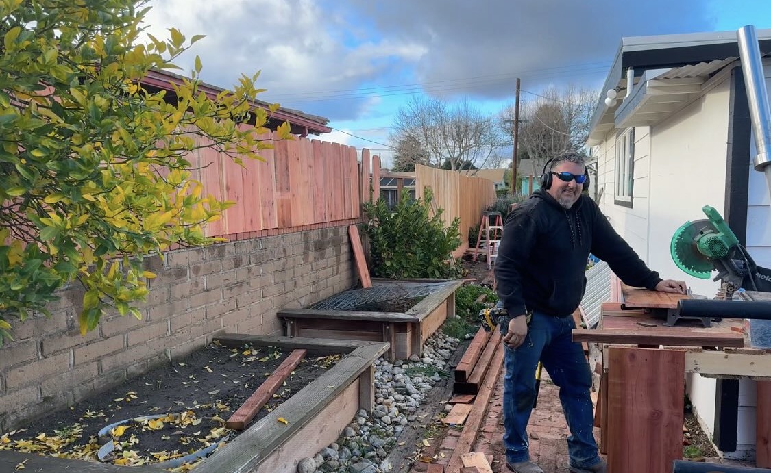 Eric working on a fence and outdoor carpentry project